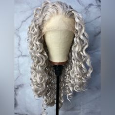 Hair Length: 24 Inches Hair Style: Long Curly Hair Color: Silver Grey Hair Density: 150% -180% Hair Material: 100% High Quality Heat Resistant Synthetic Hair Cap Size: Medium Net Size, Average 22.75” Silver Gray Human Hair Wigs, Long Curly Hair Color, Style Long Curly Hair, Grey Lace Front Wig, Curly Silver Hair, Hair Color Silver, Silver Wig, Curly Hair Color, Gray Wig