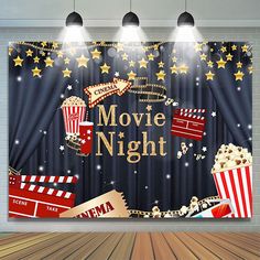 an image of a movie night scene with popcorns and stars on the stage curtain