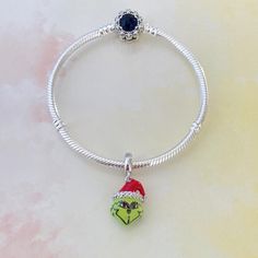 ♡The handmade Grinch charm will fit on Pandora bracelets,Chamilia,European charm bracelets,etc. (The hole size is about 4.5mm) ♡If your parcel doesn't arrive within the estimated delivery time,please message me before leaving a bad review. ♡Thank you for visiting my shop.Please contact us via Etsy Message if you have any questions,we're here to help. Decemeber Burth Stone Pandora Charm, Silver Charm Bracelet For Christmas, Christmas Festive Jewelry Charms, Cheap Christmas Holiday Charm Bracelet, Christmas Festive Silver Charm Bracelet, Der Grinch, Bracelets Pandora, The Grinch Christmas, Bracelet Pandora