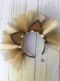 the headband is made out of tulle and wood