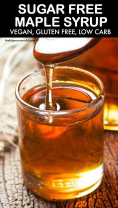 sugar free maple syrup is being poured into a glass jar