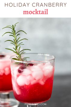 holiday cranberry cocktail with ice and rosemary garnish on the rims