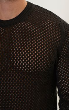 Dare to stand out with our See Through Fishnet Muscle Fit Shirt, the epitome of rebellious style and confidence. Crafted from high-quality fishnet fabric, this shirt offers a unique blend of sensuality and streetwear flair. Designed to showcase your physique, the muscle fit silhouette hugs your body in all the right places, accentuating your muscular build and adding a touch of allure to your look. The see-through nature of the fishnet fabric adds an element of mystery and intrigue, allowing you to make a bold fashion statement wherever you go. Whether you're hitting the club scene, attending a festival, or simply expressing your individuality on the streets, our See Through Fishnet Muscle Fit Shirt is sure to turn heads and command attention SIZE + FIT Tailored fit, to find your correct s Black Fishnet Mesh Top, Black Mesh Fishnet Top, Fitted Black Mesh Top With Open Knit, Fitted Black Open Knit Mesh Top, Black Open Knit Mesh Top For Summer, Black Fishnet Mesh Top For Summer, Casual Black Mesh Top With Open Knit, Casual Black Open Knit Mesh Top, Fitted Black Fishnet Mesh Top