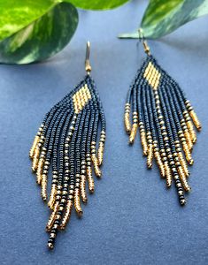 Black Beaded Earrings With Round Beads And Fringe, Black Beaded Fringe Earrings With Round Beads, Gold Beaded Earrings With Black Beads For Party, Elegant Gold Beaded Earrings With Fringe, Elegant Black Beaded Earrings With Gold Beads, Black And Gold Beaded Drop Earrings, Black Beaded Drop Earrings With Gold Beads, Black Beaded Earrings With Dangling Beads For Evening, Black Beaded Dangling Earrings For Evening