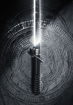 a black and white photo of a light saber in the middle of a circle with words written on it