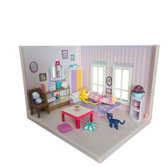 a doll house with furniture and accessories in it