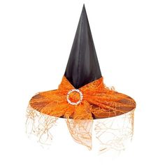 an orange and black witches hat on top of a white table with a ring around it