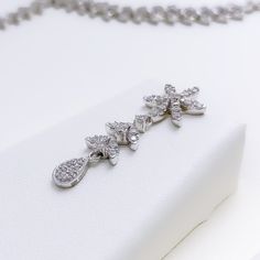 Radiant White Gold Diamond Necklace Set - the perfect addition to any sophisticated ensemble. Crafted from 18k white gold and weighing 24.1 grams, this piece features stunning round diamonds with a total weight of 2.96ct, set in a beautiful 17.5" necklace with a 1.25" drop length. It also comes with matching earrings with a length of 1.25" and screw backs for secure wearing. The lobster lock ensures this set stays safely in place, making it the perfect accessory for any occasion. PRODUCT DETAILS White Gold Diamond Pendant Necklace, Exquisite White Gold Diamond Pendant Necklace, Wedding Flower Pendant Diamond Necklace, Fine Jewelry Platinum Bridal Necklace With Diamond Accents, Fine Jewelry Bridal Necklace With Diamond Accents In Platinum, Dazzling White Gold Diamond Pendant Necklace, White Gold Flower Pendant With Brilliant Cut, White Gold Brilliant Cut Flower Pendant, Silver Bridal Necklace With Single Cut Diamonds In Platinum