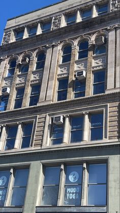 a tall building with many windows on it