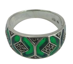 *    Delivered in a presentation box with certificate of authenticity. *    Traditional yet extremely unique, we have meticulously made and hand finished this sterling silver women's ring in England to the highest standards. Decorative in design and combining 92.5% pure silver       with green enamel and a strong shape, it's guaranteed to become an heirloom of the future. *    92.5% silver ring with green enamel. *    Crafted from Hallmarked sterling silver. *    A beautiful women's ring. *    A Silver Sterling Enamel Ring In Fine Jewelry Style, Green Enamel Ring For Anniversary, Hallmarked Green Enamel Ring For Anniversary, Unique Green Enamel Ring For Anniversary, Unique Green Enamel Anniversary Ring, Green Hallmarked Enamel Ring For Anniversary, Green Anniversary Rings With Inlay, Silver Hallmarked Enamel Ring In Fine Jewelry Style, Sterling Silver Jewelry With Green Inlay