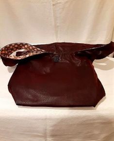 Large brown hobo bag. Would work for a diaper bag as well.  Fully lined wih cotton fabric. Measures 12" x 15" x 4". Button and loop closure. Has one open pocket on the inside along with a zipper pocket. Handle drop is approximately  17". Chesapeake Va, Hobo Bag, Purses And Handbags, Diaper Bag, Zipper Pocket, Shoulder Bags, Cotton Fabric, Shoulder Bag, Zipper