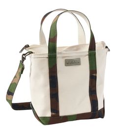 Introduced in 1944 as "Bean's Ice Carrier, " the beloved Boat and Tote is still crafted in Maine, one tote at a time. This 80th anniversary edition celebrates its classic style, legendary durability and the adventures to come. Spot clean. Zip-top closure. Reinforced flat canvas bottom. Double-layer base. Heavy-duty 24 oz. cotton canvas. Hanging pocket inside. Adjustable, removable shoulder strap. Add a monogram for a personal touch (or the perfect gift). Exclusive Boat and Tote® 80th Anniversary Llbean Tote, Boat And Tote, Bottom Heavy, Business Laptop Bag, 80th Anniversary, Backpacking Gear, Gear Bag, Crossbody Tote Bag, Travel Tote