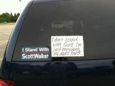 a sticker on the back of a car that says, i stand with scott walker