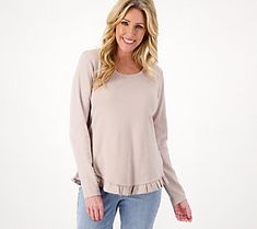 A curved hem with a ruffle edge gives this knit top a feminine touch. Pair it with anything from leggings to jeans to shorts. From Isaac Mizrahi Live!TM. Ruffled Knit Top For Layering, Cotton Knit Top With Ruffles For Fall, Fall Cotton Knit Top With Ruffles, Frayed Hem Tops For Fall Layering, Casual Ruffle Hem Tops For Fall, Fall Layering Tops With Frayed Hem, Stretch Ruffle Tops For Layering, Chic Tops With Frayed Hem For Fall, Casual Ruffle Knit Top For Fall