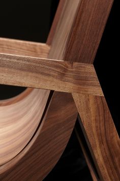 a close up of a wooden chair with wood graining on the back and sides