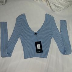 Ribbed Long Sleeve V Neck Sweater Light Blue Sz Large Nwt Fashion Nova Light Blue Knit V-neck Top, Blue Ribbed Stretch Sweater, Blue Stretch Ribbed Sweater, Winter Light Blue Ribbed Top, Light Blue Fitted V-neck Sweater, Trendy Light Blue V-neck Sweater, Fitted Light Blue V-neck Sweater, Fitted V-neck Light Blue Sweater, Blue Ribbed Sweater For Spring