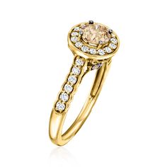 a yellow gold engagement ring with diamonds