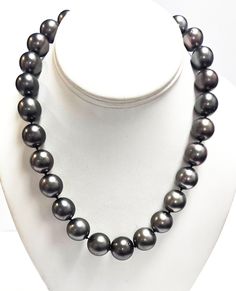 Designer:  KCJ Metal:  14k White Gold 27 Tahitian Pearls:  size range = 14 mm - 17.5 mm Closure:  hook clasp to 14 mm, 14k white gold with diamonds bead; stamped KCJ 22 Round Diamonds:  total carat weight = 0.10 -0.15 CTW Necklace Length:  18 inches Total Weight:  148 grams Note: There are very small blemishes, also known as dimples, that can be seen that were naturally formed during the cultivation process. On the largest pearl, it appears that one dimple was filled; others may have had treatme Pearl Strands Necklace, Pearl Strands, Tahitian Pearls, Selling On Ebay, Strand Necklace, Jewelry Business, Tahiti, Fine Jewellery Necklace, Round Diamonds