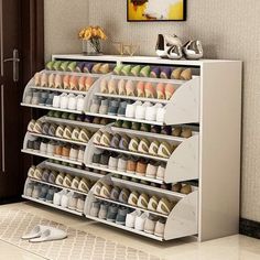 an organized shoe rack in the corner of a room