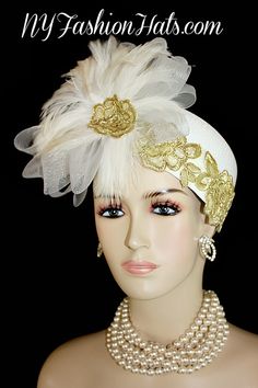 Women's White Pillbox Fashion Designer Haute Couture Hat Trimmed With A Large White Crinoline Horse Hair Bow, Enhanced With Expensive White Rooster Feathers. Metallic Gold Embroidered Flower Appliques Are Placed Around The Crown Of This Fashion Hat, As Well As Placed In The Center Of The Feathers. This Formal Hat Can Be Worn In Different Positions. This ladies hat is appropriate to wear for the Kentucky Derby, Melbourne Cup, Royal Ascot, horse races, Saratoga racing, Church, weddings, and specia Vintage White Hat Headpiece, White Hat For Vintage Events, Vintage White Costume Hats And Headpieces For Wedding, Vintage White Costume Hats For Wedding, White Vintage Wedding Costume Hats And Headpieces, Vintage White Wedding Costume Hats And Headpieces, Vintage White Headpiece For Kentucky Derby, Flapper Style Fascinator For Vintage Events, Gatsby Style Hat For Vintage Events