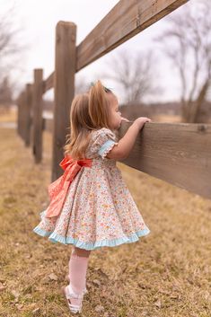 Get ready to turn heads and make all the other spring dresses jealous with our Small and Sweet Twirl Dress! This darling dress takes twirl to a 10 with its deluxe double layered skirt! The lined bodice, button front, and ruffled puff sleeves add a touch of charm. And then there's the gorgeous big bow that ties it all up in perfection! You will not be disappointed in this amazing dress! Perfect for all spring occasions- birthdays, weddings, graduations and more! Matching cartwheel shorts availabl Twirl Dress, Darling Dress, 2 Girl, Big Bow, Layered Skirt, Big Bows, First Baby, Spring Dresses, I Dress