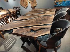 a wooden table with chairs around it