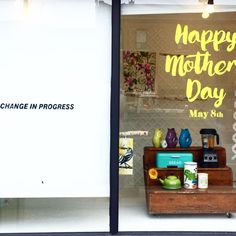 there is a sign in the window that says happy mother's day