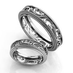 two wedding bands are shown with intricate designs on the inside and outside of each band