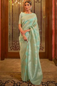 Women's Silk Blend Green Woven Design Celebrity Saree With Blouse Product Features: Saree Color: Sea Green Blouse Color: Sea Green Saree Fabric: Silk Blend Blouse Fabric: Silk Blend Saree Type: Banarasi Saree Work: Embroidered Saree Pattern: Embroidered Saree Print : Ethnic Motif Blouse Print Or Pattern: Woven Design Saree Border: Woven Design Saree Discription: 5.5 mtr saree And 0.8 mtr blouse Package Contain: 1 Saree 1 Blouse Wash: Dry Clean Occasion: Party/Wedding/Evening/Event Product: Silk Blue Silk Saree, Crepe Saree, Handloom Fabric, Half Sleeve Blouse, Wedding Saree Indian, Ethnic Looks, Green Saree, Blue Saree, Art Silk Sarees