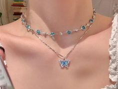 ✨ Add a touch of elegance to any outfit with our Romantic Blue Crystal Butterfly Necklace! This stunning piece features a delicate butterfly design adorned with sparkling zircon crystals that catch the light beautifully. 💙 🌟 Key Features: Charming Design: Romantic blue butterfly motif with sparkling zircon stones. Double Layered: Stylish double-layer choker that sits gracefully on your collarbone. Versatile Wear: Perfect for everyday wear or special occasions. Perfect Gift: Ideal for birthdays, anniversaries, or just because! Whether you're dressing up for a night out or adding a bit of sparkle to your everyday look, this necklace is sure to become your go-to accessory. Treat yourself or someone special to this beautiful piece! 🎁 Blue Butterfly Accessories, Blue Butterfly Charm Jewelry For Party, Elegant Blue Butterfly Charm Necklace, Elegant Blue Butterfly Necklace With Charm, Crystal Butterfly Necklace, Romantic Blue, Butterfly Motif, Delicate Butterfly, Layered Chokers