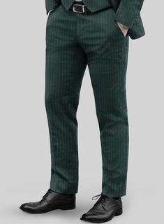 Discover a distinctive interpretation of our Green Pinstripe Pants, where sophistication is elevated to its zenith while reveling in its remarkable versatility. Made from a wool blend material, these pants exude richness and decadence. It comes in a refreshing shade of green adorned with sleek pinstripes that are bound to steal the spotlight. Whether you're in pursuit of the perfect wedding attire, a debonair choice for your groomsmen or an ensemble to turn heads at the racetrack, these pants h Tailored Vertical Stripe Business Pants, Tailored Vertical Stripe Pants For Business, Classic Striped Dress Pants For Formal Occasions, Business Tailored Vertical Stripes Pants, Formal Tailored Pants With Vertical Stripes, Formal Dress Pants With Vertical Stripes And Straight Leg, Classic Striped Pants For Formal Occasions, Tailored Striped Pants With Welt Pockets, Pinstripe Tapered Leg Dress Pants For Formal Occasions