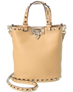 About The Brand: Signature Elegance With A Modern Aesthetic. Made In Italy Rockstud Grainy Leather Crossbody In Nude Grainy Leather With Platinum-Finish Rockstuds Interior Design Details: Suede Lining, Card Slots Measures 6.5In Wide X 7.5In High X 3.5In Deep Top Handles Drop 4In Adjustable And Removable Shoulder Strap Drops 22In Turnlock Closure Please Note: All Measurements Were Taken By Hand And Are Approximate; Slight Variations May Occur. Our Products Are 100% Genuine. In Some Cases We Purchase Merchandise From Trusted Independent Suppliers And Not Directly From The Brand Owner. In All Cases We Stand By The ity Of Every Product Sold On Our Site. Interior Design Details, Brand Owner, Valentino Rockstud, Modern Aesthetic, Medium Bags, Cross Body Handbags, Leather Crossbody, Luxury Branding, Design Details