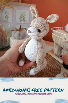 a crocheted stuffed animal in the shape of a bunny sitting on a table