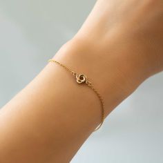 This dainty Love knot bracelet is the perfect friendship gift or gift for her. Gold Filled Love Knot Diameter 1/4in (6mm) Chain Length: 6-7.5in (15-19cm) Lobster Clasp Handcrafted in NYC Hypoallergenic, lead and nickel free #B312-GF Delicate Hypoallergenic Jewelry For Friendship, Elegant Rose Gold Heart Bracelet For Friendship, Dainty Adjustable Heart Bracelet For Promise, Dainty Infinity Bracelet For Everyday Wear, Dainty Infinity Bracelet For Everyday, Elegant Hypoallergenic Chain Bracelet For Friendship, Delicate Rose Gold Friendship Bracelet, Dainty Infinity Bracelets For Friendship, Bracelets With Spring Ring Clasp As Gift