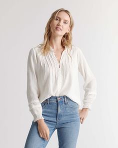 Meet our modern version of the classic peasant blouse. Our Organic Textured Cotton Peasant Blouse is just right for days when you’re feeling boho fabulous. With long sleeves, a ruffled stand collar, button front, and elasticized ruffle cuffs, isn’t it pretty? Silk Pajamas Shorts, White Peasant Blouse, Comfortable Blouses, Silk Tee, Cotton Crafts, Pretty Shirts, Quarter Zip Sweater, Summer Blouses, Work Wardrobe