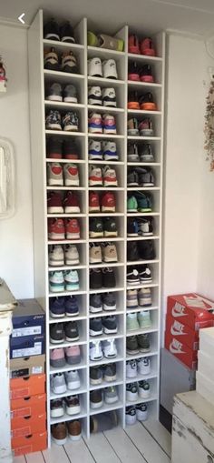 a large white shelf filled with lots of shoes