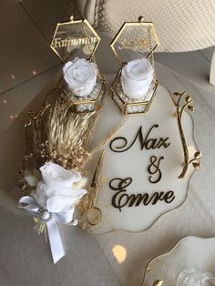 wedding cake with white flowers and gold decoration