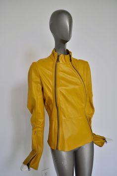 Great leather jacket made by Nolita NYC. The jacket is in very good pre-owned condition, bright yellow color, two zippers on front. There are no pockets no lining. Supple leather. Nolita was a great design company for clothing from Brooklyn NY. The sleeves have also metal zippers inserted on the side. Please inquire with questions. Free domestic shipping, get 15% discount w code crazyfashion Measures Length 21 inch Shoulder 16 inch Bust 34 inch all around Sleevelength 26 inch Waist 30 inch Yellow Leather Long Sleeve Outerwear, Yellow Leather Jacket For Winter, Yellow Fitted Long Sleeve Biker Jacket, Yellow Leather Jacket With Long Sleeves, Yellow Long Sleeve Leather Jacket, Fitted Yellow Biker Jacket For Fall, Yellow Leather Jacket For Spring With Long Sleeves, Yellow Long Sleeve Leather Jacket For Spring, Nolita Nyc