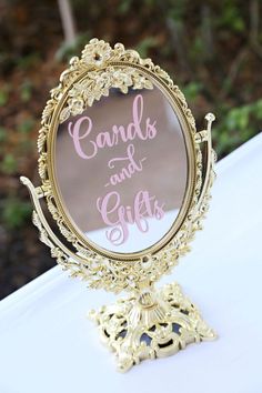 a mirror sitting on top of a white table