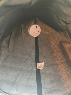 the inside of a bag with a button on it