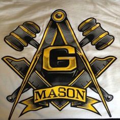 the masonic symbol is shown on a white shirt with black and gold trimmings