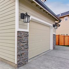 a garage with a light on the side of it