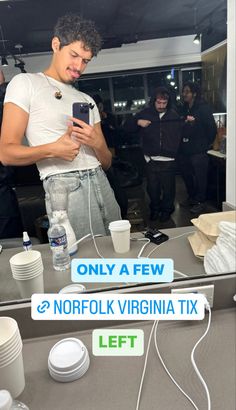 a man standing in front of a mirror looking at his cell phone with the caption'only a few norfolk virginia tax left '