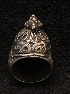 Ring ~ Vintage Tribal Dome Ring, Yeman Size 7 1/2 Early 1900's A Warrior Princess Ring This is an impressive and heavy Bedouin tower ring. It has decorations on all sides of the tower, a pyramid of silver drops that spill over to the sides of the single shank band. The ring face tests positive for silver but the shank has little precious metal. It is in good vintage condition and looks lovely on. Yes ~ along with basic simplicity ~ It's all about you You deserve to know about my fabulous Treasur Antique Etched Rings For Ceremonial Occasions, Traditional Carved Rings For Ceremonial Occasions, Traditional Carved Ceremonial Rings, Traditional Etched Ceremonial Rings, Traditional Etched Rings For Ceremonial Occasions, Unique Etched Ceremonial Jewelry, Unique Etched Jewelry For Ceremonial Occasions, Antique Silver Ceremonial Rings, Antique Ceremonial Ring Jewelry