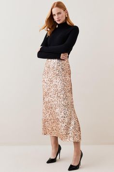 A Combination Of Femininity And Glamour, The By Lydia December '22: An Exploration Of Beauty Collection Showcases Sartorial Elegance Through Elevated Everyday Staples Alongside Luxe Evening Styles.Ensure You'Re Party-Ready This Season In This Gleaming Sequin Skirt. Rose Gold Sequins Glisten With Every Ray Of Light, Creating A Truly Showstopping Effect. Pair This Skirt With A Rollneck Jumper And Stiletto Heels For A Luxurious Desk-To-Bar Look.Rose Gold Sequinsmaxi Hemlineinvisible Rear Zipthis Is Elegant Cocktail Maxi Skirt With Lined Detail, Feminine Formal Pleated Skirt, Glamorous Pleated Skirt For Parties, Sequined Flowy Party Skirt, Formal Spring Midi Skirt, Elegant Flared Skirt For Gala, Chic Midi Dress For Workwear, Formal Lined Maxi Skirt For Spring, Formal Midi Skirt For Spring