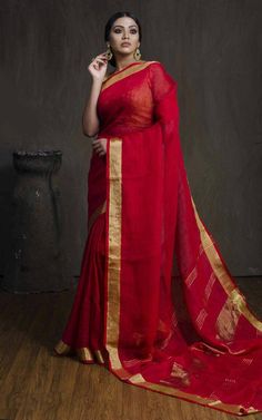 Linen sarees are always in demand.This handwoven red linen saree with pure gold zari border give you a unique style.The color is so vibrant that you are going to love it.Linen sarees are breathable,light weight and easy to drape. Fabric: Linen by linen  Thread count:100 count Saree Color: Red Occasion: Casual/Formal Saree length:5.50 mtr Blouse:80 cm Custom Stitching: Available upon request Saree Embroidery: Available upon request Blouse Stitching: Available upon request Shipping: 7 to 10 busine Red Slub Silk Saree With Weaving Work, Linen Saree With Pallu, Festive Linen Saree With Pallu Detail, Traditional Linen Saree With Zari Work, Linen Saree With Cutdana Detailing, Traditional Linen Saree With Cutdana, Traditional Linen Saree With Pallu, Traditional Linen Saree For Festive Occasions, Linen Cutdana Saree For Festive Occasions