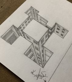 a pencil drawing of a cross on top of a piece of paper