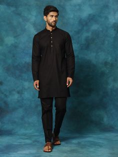 VASTRAMAY Men's Black Cotton Blend Kurta Pyjama Set Elevate your ethnic wear collection with this classic black kurta pyjama set from VASTRAAY. Made from a comfortable cotton blend, this set is perfect for festive occasions, casual wear, or lounging at home. Features: Black, knee-length kurta with mandarin collar Long sleeves with button placket Black, mid-rise pyjama with drawstring closure Two side pockets for added functionality Specifications: Material: Cotton blend (exact blend percentage m Black Kurta, Kurta Pyjama, Pyjama Set, Ethnic Wear, Product Images, Mandarin Collar, Button Placket, Black Cotton, Classic Black