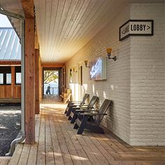 the inside of a building with benches and windows