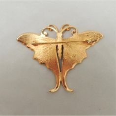 This is part of Chairish’s Costume Jewelry assortment.  Goldtone light and dark green enamel butterfly brooch with security clasp. Marked "Napier." Measures: 2 1/8 inches long by 2 3/4 inches wide. Condition: Very good; perhaps the slightest of surface wear to the goldtone. A blue and green enamel version of this brooch was featured in a c1971 advertisement. I also have a yellow and orange version of this pin as well as one of the other butterflies from the same advertisement.  Please reference Gold Butterfly Brooch For Formal Occasions, Vintage Yellow Gold Enamel Pin, Gold Butterfly Brooches For Collectors, Butterfly Brooch For Evening Wear, Evening Butterfly Brooch Jewelry, Vintage Gold Butterfly Jewelry, Vintage Butterfly Brooch For Formal Occasions, Elegant Butterfly Brooch, Elegant Butterfly Brooches For Evening